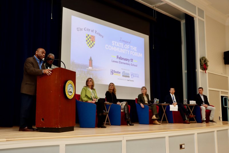 Bill and Nancy Collick, left, open the inaugural Lewes State of the Community forum at the Lewes Elementary School Feb. 17. The Collicks shared stories of growing up in Lewes. The forum was a discussion among four Lewes leaders, who shared the stage. Shown are (l-r) Amy Marasco, Lewes mayor; Dr. Jenny Nauman, Cape Henlopen School District superintendent; Dr. Laura Carlson, University of Delaware president; Dr. David Tam, Beebe Healthcare president and CEO; and Chris Rausch, Cape Gazette owner and publisher, who served as the host. BILL SHULL PHOTOS
